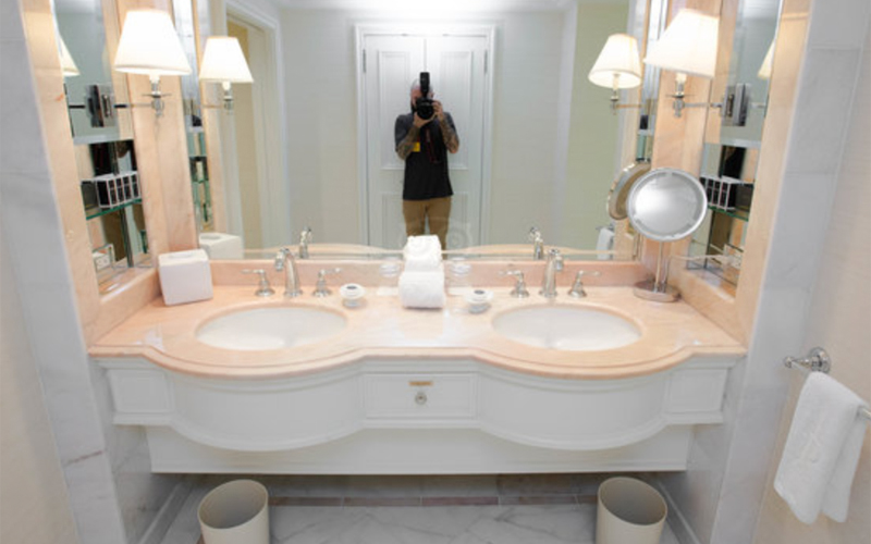 Beige marble tops vanity with white wooden base